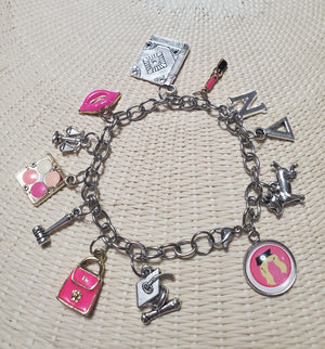 A Legally Blonde Charm Bracelet from The Lobby Boutique with themed merchandise. A Legally Blonde Charm Bracelet from The Lobby Boutique with themed merchandise.