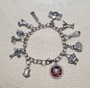 A DROWSY CHAPERONE Charm Bracelet from The Lobby Boutique, with a variety of charms on it. A DROWSY CHAPERONE Charm Bracelet from The Lobby Boutique, with a variety of charms on it.