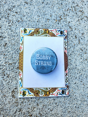 URINETOWN "Bobby Strong" Metal Pinback Button URINETOWN "Bobby Strong" Metal Pinback Button