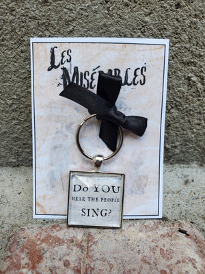 LES MISERABLES "Do You Hear the People Sing?" Glass Cabachon Keychain LES MISERABLES "Do You Hear the People Sing?" Glass Cabachon Keychain
