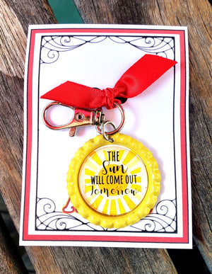 ANNIE "The Sun Will Come Out Tomorrow" Keychain ANNIE "The Sun Will Come Out Tomorrow" Keychain
