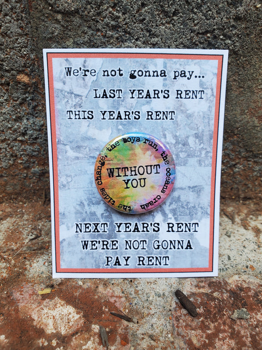 You're not paying last year's RENT "Without You." Metal Pinback Button, this next year's merchandise pin from The Lobby Boutique.