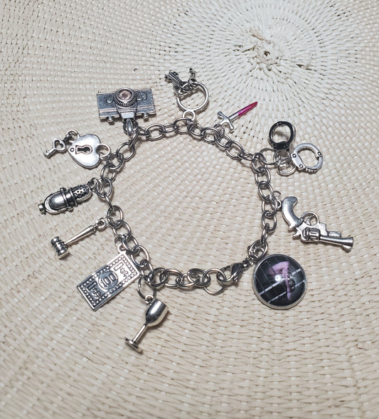 A CHICAGO Charm Bracelet with a variety of themed charms, inspired by Chicago, from The Lobby Boutique.