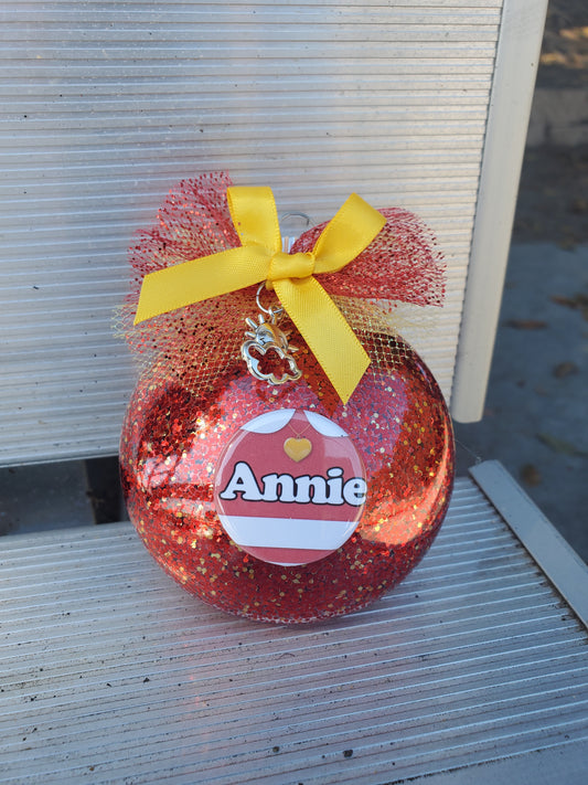 A red pumpkin with a yellow ribbon on it - the ANNIE Christmas Ornament by The Lobby Boutique, a unique Christmas ornament.