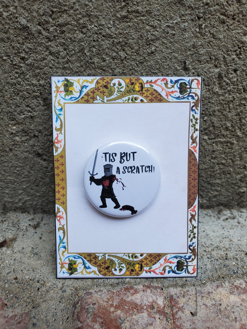 SPAMALOT "Tis But a Scratch" Metall Button