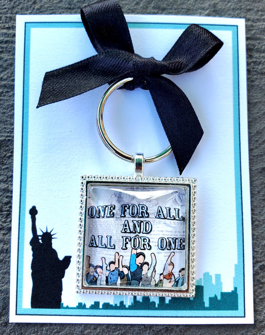 NEWSIES "All For One and One For All" Glass Cabachon Keychain