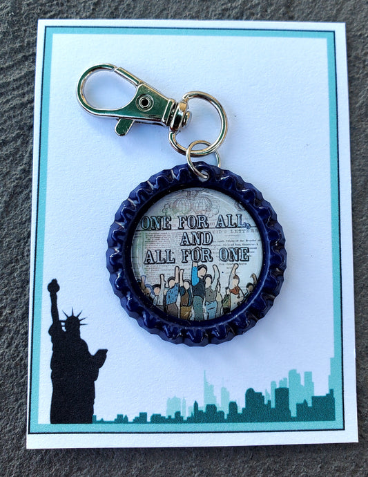 NEWSIES "All For One and One For All" Bottlecap Keychain