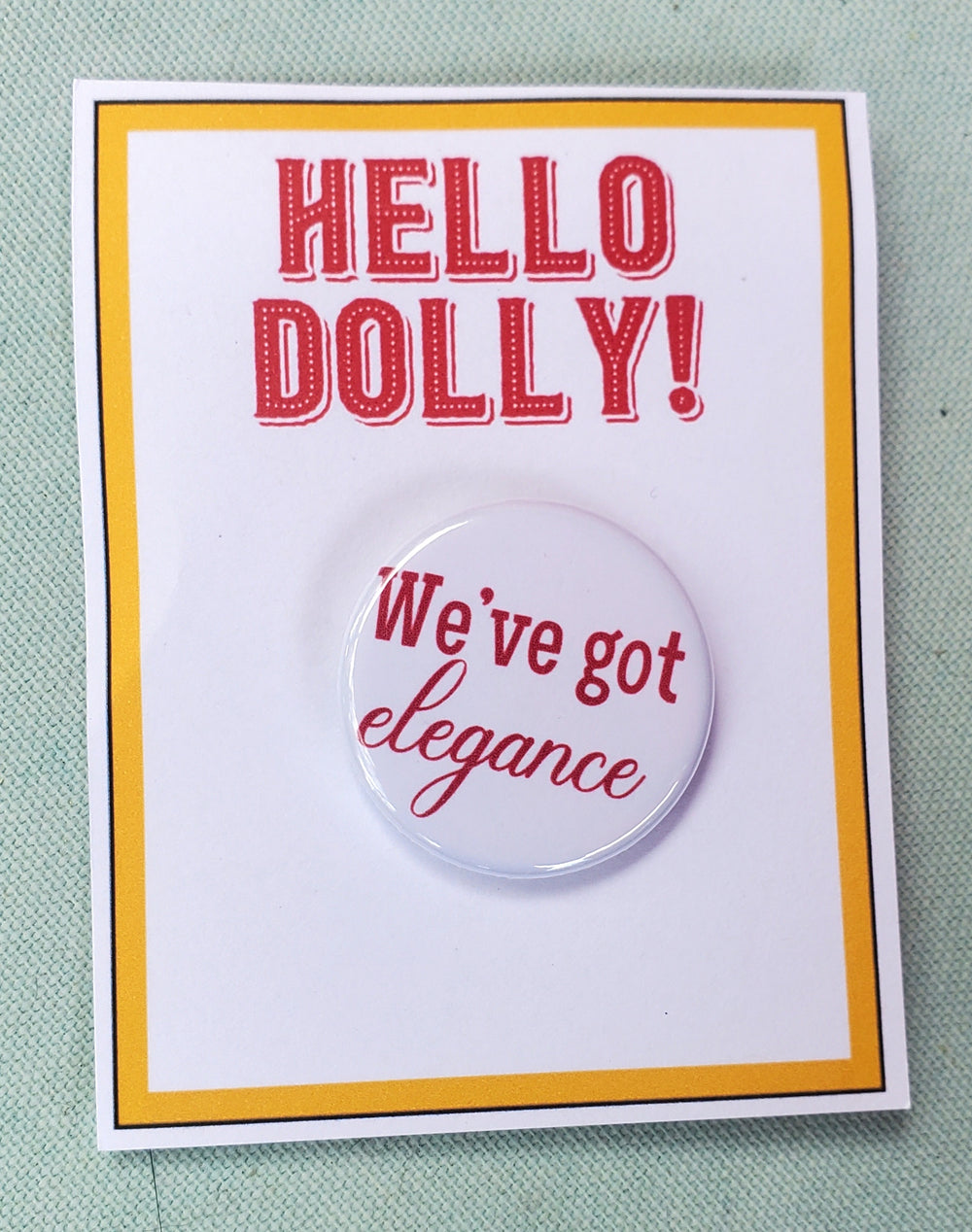 HELLO DOLLY "We've Got Elegance" Metal Pinback Button